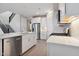 Modern kitchen features stainless steel appliances, a center island, and ample cabinet space at 5848 E Covey Ln, Phoenix, AZ 85054