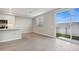 Bright living room featuring hardwood floors, a backyard view, and neutral wall colors at 5848 E Covey Ln, Phoenix, AZ 85054