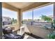 Inviting balcony with outdoor seating, offering a relaxing view of community landscapes at 734 E Doral Ave # 202, Gilbert, AZ 85297
