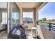 This cozy balcony features comfortable seating and views, perfect for enjoying fresh air at 734 E Doral Ave # 202, Gilbert, AZ 85297