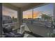 Relaxing balcony with woven chairs, decorative plants, and a serene view of the surrounding neighborhood at 734 E Doral Ave # 202, Gilbert, AZ 85297