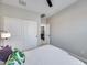 This bedroom has a modern neutral decor, a ceiling fan, and a wardrobe at 734 E Doral Ave # 202, Gilbert, AZ 85297
