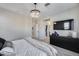 Light and airy bedroom with modern lighting, neutral colors, and walk-in closet at 734 E Doral Ave # 202, Gilbert, AZ 85297