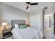 This bedroom boasts a ceiling fan, neutral colors and a ensuite bathroom at 734 E Doral Ave # 202, Gilbert, AZ 85297