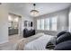 Bright bedroom with modern lighting, plantation shutters, and ensuite bath access at 734 E Doral Ave # 202, Gilbert, AZ 85297
