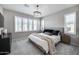 Serene bedroom featuring a stylish chandelier and lots of natural light from large windows at 734 E Doral Ave # 202, Gilbert, AZ 85297