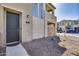 Inviting townhouse entrance with a stylish door, balcony views, and desert landscaping at 734 E Doral Ave # 202, Gilbert, AZ 85297