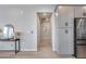 Bright entryway featuring modern decor, stainless steel appliances and light hardwood floors at 734 E Doral Ave # 202, Gilbert, AZ 85297