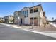 Modern two-story townhouse featuring a balcony, desert landscaping, and a well-maintained facade at 734 E Doral Ave # 202, Gilbert, AZ 85297