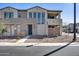 Contemporary two-story townhouse with desert landscaping, a modern facade, and street access at 734 E Doral Ave # 202, Gilbert, AZ 85297