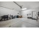 Open garage featuring epoxy flooring, ample space for parking, and lots of accessories at 734 E Doral Ave # 202, Gilbert, AZ 85297