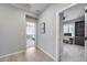 Hallway that leads into a bedroom and an office space with carpeted floors at 734 E Doral Ave # 202, Gilbert, AZ 85297
