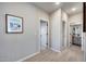 Light-filled hallway with wood floors, connecting various rooms and bathroom at 734 E Doral Ave # 202, Gilbert, AZ 85297