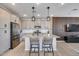 Modern kitchen featuring stainless steel appliances, a center island with seating, and pendant lighting at 734 E Doral Ave # 202, Gilbert, AZ 85297