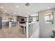 Spacious living room featuring an open floor plan with light wood floors at 734 E Doral Ave # 202, Gilbert, AZ 85297