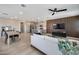 Open floor plan with a living area, kitchen with island, and dining table at 734 E Doral Ave # 202, Gilbert, AZ 85297