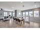Open-concept living and dining area with large windows and modern furnishings at 734 E Doral Ave # 202, Gilbert, AZ 85297