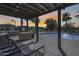 Outdoor community pool featuring lounge chairs, a built-in grill and pergola at 734 E Doral Ave # 202, Gilbert, AZ 85297