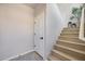 Bright interior staircase with wooden steps, white railing, and modern decor elements at 734 E Doral Ave # 202, Gilbert, AZ 85297