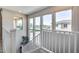 Bright staircase featuring large windows offering natural light and scenic views at 734 E Doral Ave # 202, Gilbert, AZ 85297