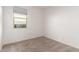 Neutral bedroom with a window and carpeted floors at 7456 N 126Th Ln, Glendale, AZ 85307