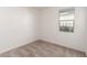 Bedroom with carpet and view of the fence at 7456 N 126Th Ln, Glendale, AZ 85307