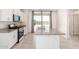 Modern kitchen featuring white cabinets, granite countertops, and stainless steel appliances at 7456 N 126Th Ln, Glendale, AZ 85307