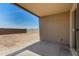 Inviting covered patio that overlooks the expansive backyard at 7456 N 126Th Ln, Glendale, AZ 85307