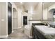 Well-appointed bathroom shows a soaking tub, vanity with granite countertop, and spacious walk-in closet at 7601 E Indian Bend Rd # 2056, Scottsdale, AZ 85250