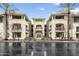 Beautiful condo exterior featuring desert landscaping, stone accents, and a well-maintained facade at 7601 E Indian Bend Rd # 2056, Scottsdale, AZ 85250
