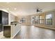 Bright living room with open floor plan, tile flooring, fireplace, and views of the outdoor balcony at 7601 E Indian Bend Rd # 2056, Scottsdale, AZ 85250