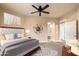 Comfortable main bedroom features neutral tones, ceiling fan, and ensuite bathroom with walk-in closet at 7601 E Indian Bend Rd # 2056, Scottsdale, AZ 85250