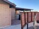 Backyard area with a brick wall, gravel and wooden privacy fence at 8640 S 16Th Pl, Phoenix, AZ 85042