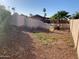 Large gravel backyard with partial pool view and block wall at 8640 S 16Th Pl, Phoenix, AZ 85042