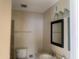 A bright bathroom with a new mirror, sleek lighting, and modern fixtures for a clean and inviting space at 8640 S 16Th Pl, Phoenix, AZ 85042