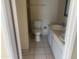 A bathroom with tile flooring, a toilet and sink, and a towel rack for a functional design at 8640 S 16Th Pl, Phoenix, AZ 85042