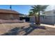 Front yard view with desert landscaping and mature trees at 8640 S 16Th Pl, Phoenix, AZ 85042