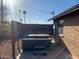 Backyard hot tub area with privacy fencing and brick accents at 8640 S 16Th Pl, Phoenix, AZ 85042