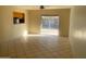 Open living area with bright sliding glass doors and tile flooring offering seamless indoor/outdoor living at 8640 S 16Th Pl, Phoenix, AZ 85042