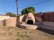 Charming outdoor fireplace feature in backyard at 8640 S 16Th Pl, Phoenix, AZ 85042