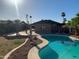 Backyard pool area with gazebo and desert landscaping at 8640 S 16Th Pl, Phoenix, AZ 85042