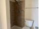 This bathroom features a modern tiled walk-in shower and sleek fixtures for a luxurious experience at 8640 S 16Th Pl, Phoenix, AZ 85042