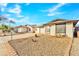 Charming single-story home featuring a well-maintained front yard and attached garage at 8760 W Meadow Dr, Peoria, AZ 85382