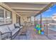 Inviting covered patio with comfortable seating area overlooking the pool at 8760 W Meadow Dr, Peoria, AZ 85382