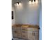 Bathroom with light wood vanity, drawers, and cabinet doors ready for fixtures and finishing touches at 10039 W Verde Ln, Avondale, AZ 85392