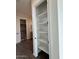 A well-organized closet with multiple shelves offering ample storage space, ideal for linens or personal items at 10039 W Verde Ln, Avondale, AZ 85392