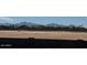 Community view with mountain backdrop; new homes will be constructed here at 10039 W Verde Ln, Avondale, AZ 85392