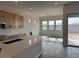 Spacious kitchen featuring wooden cabinets, a large island with white countertop, and modern stainless steel appliances at 10039 W Verde Ln, Avondale, AZ 85392