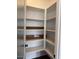 Interior view of a well-organized pantry featuring multiple shelves providing practical storage solutions at 10039 W Verde Ln, Avondale, AZ 85392