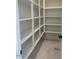 Walk-in pantry featuring generous shelving perfect for organized storage of food items and kitchen essentials at 10039 W Verde Ln, Avondale, AZ 85392